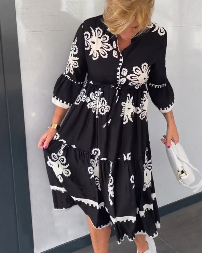 Blommig klänning med 3/4 ärm